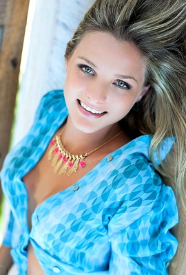 Niege Menegat has blue eyes and blue shirt